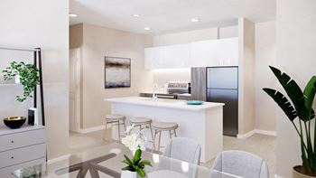 an open kitchen and dining area with a table and chairs